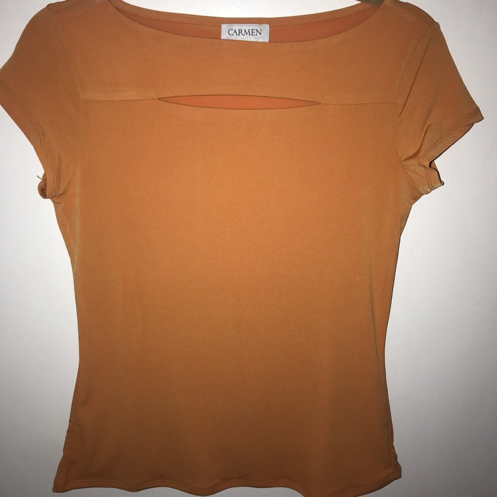 Orange Carmen Marc Valvo shirt with cutout detail